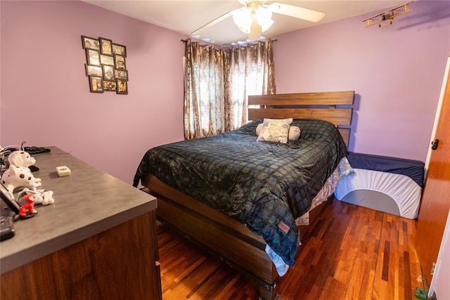 bedroom with dark wood-type flooring and ceiling fan