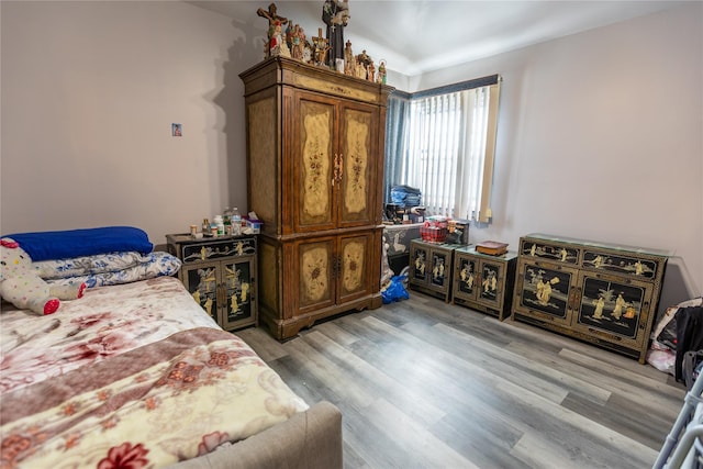 bedroom with light hardwood / wood-style floors