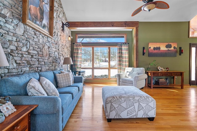 living room with ceiling fan and light hardwood / wood-style floors