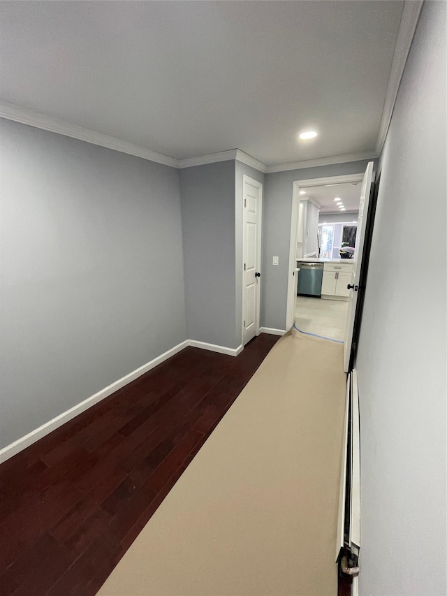 corridor featuring crown molding and dark wood-type flooring