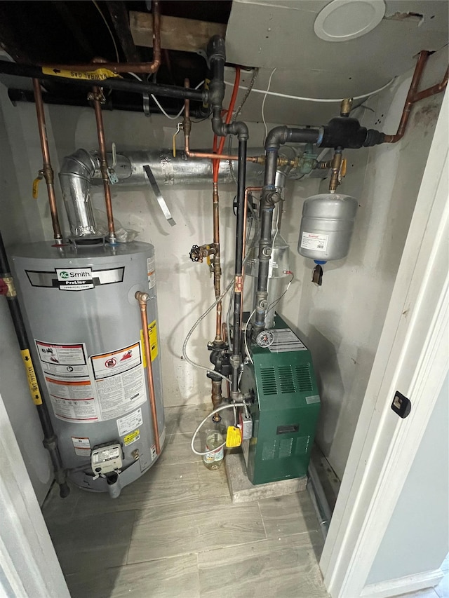 utility room with gas water heater