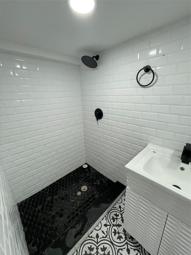 bathroom with tiled shower