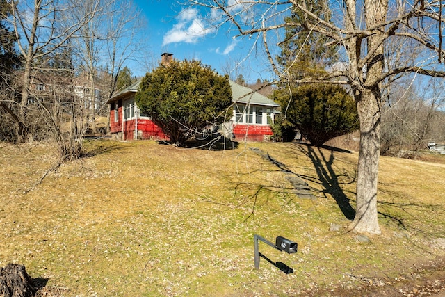 view of yard featuring a sunroom