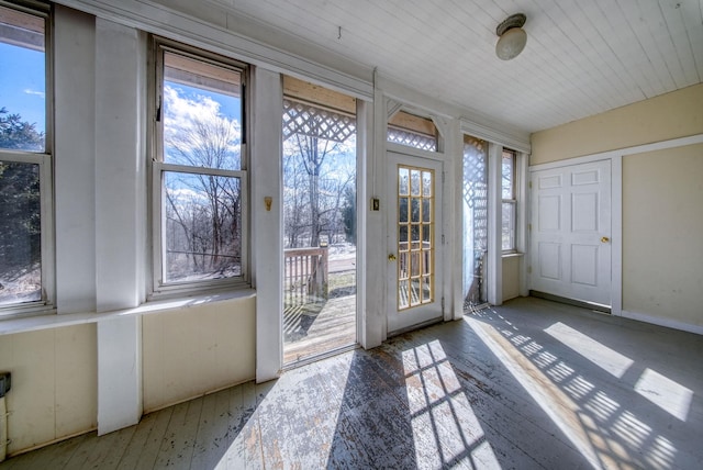 doorway to outside featuring wooden ceiling and hardwood / wood-style floors