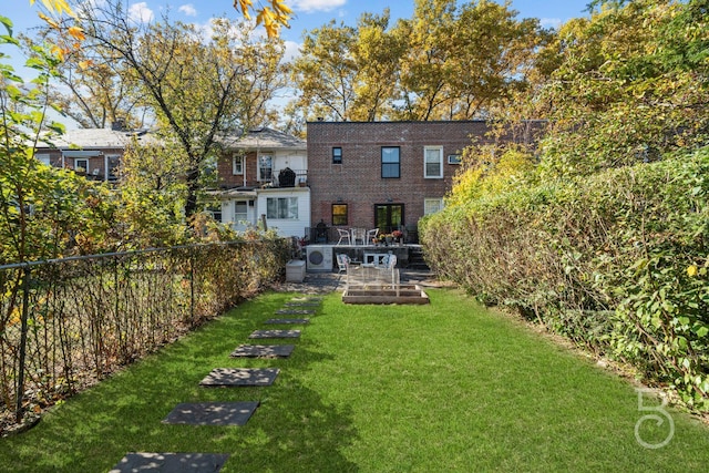 rear view of house featuring a lawn