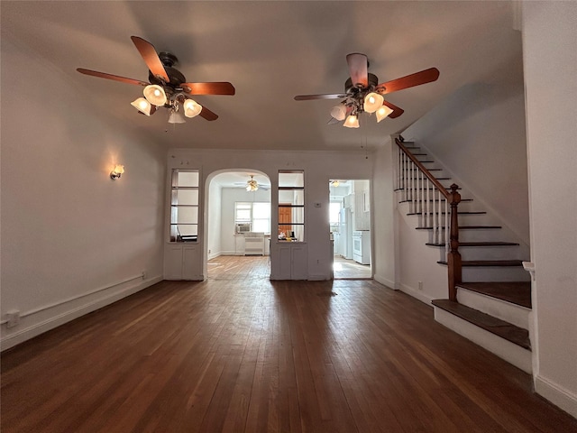 unfurnished living room featuring dark wood-type flooring