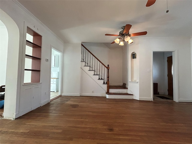 unfurnished living room featuring ornamental molding, radiator heating unit, ceiling fan, and dark hardwood / wood-style flooring