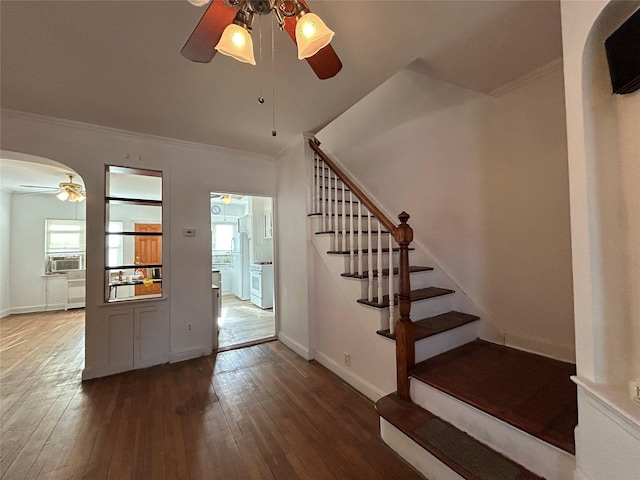 entrance foyer with crown molding, ceiling fan, hardwood / wood-style floors, and cooling unit