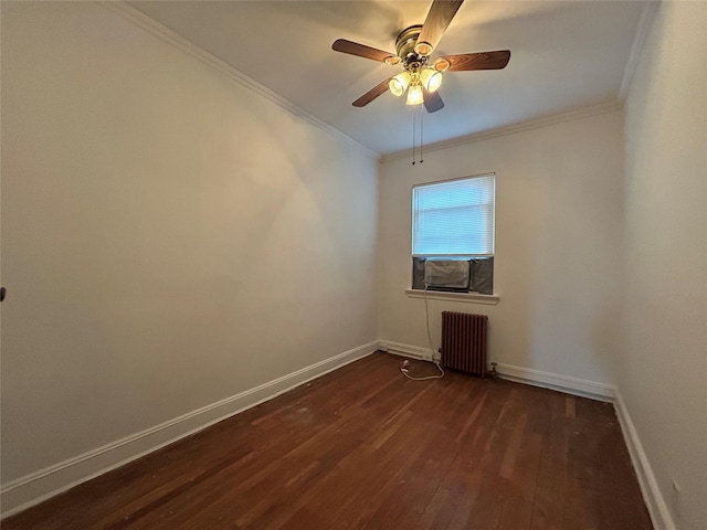 empty room featuring dark wood-type flooring, ceiling fan, crown molding, and radiator