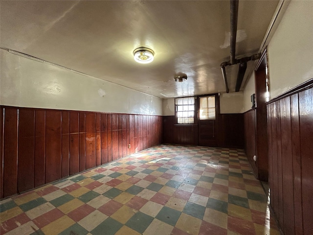 bonus room with wood walls