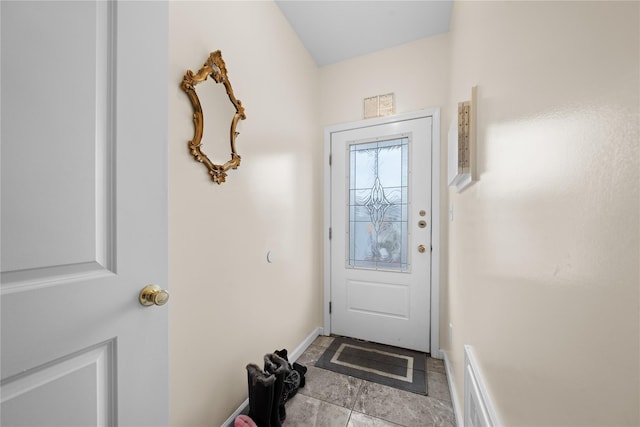 doorway to outside featuring light tile patterned floors