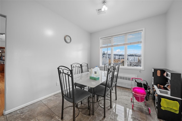 dining area featuring radiator