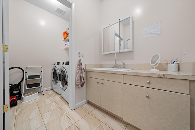 laundry room with separate washer and dryer, light tile patterned floors, and sink