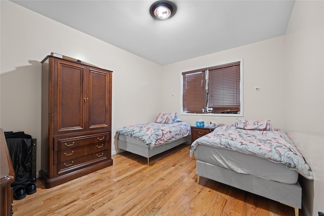 bedroom with light hardwood / wood-style flooring