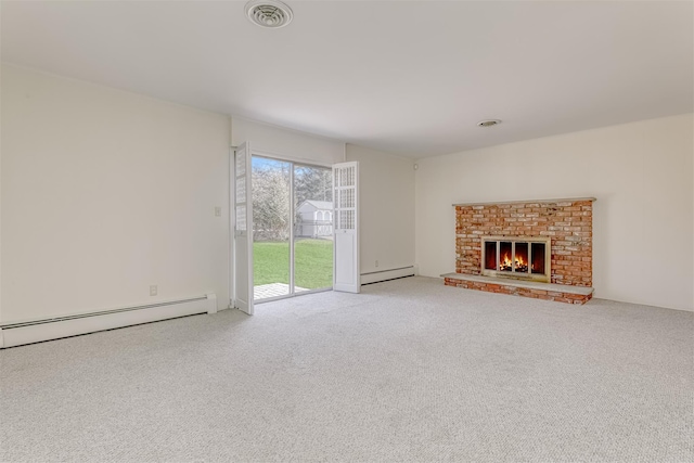 unfurnished living room featuring baseboard heating, light colored carpet, and a fireplace