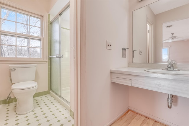 bathroom with vanity, toilet, and walk in shower