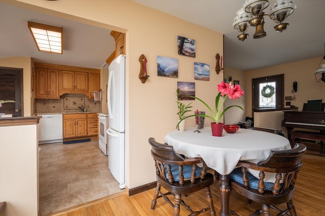 dining area featuring light wood-type flooring