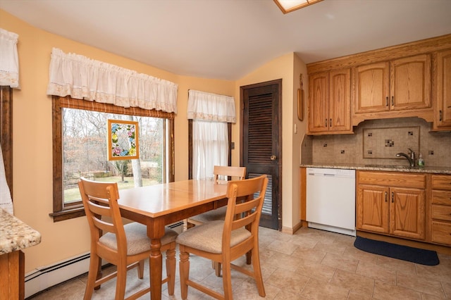 dining room featuring sink and baseboard heating