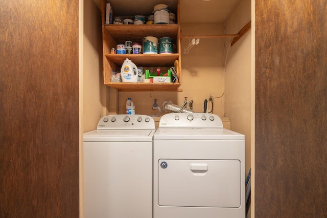 clothes washing area featuring washing machine and clothes dryer