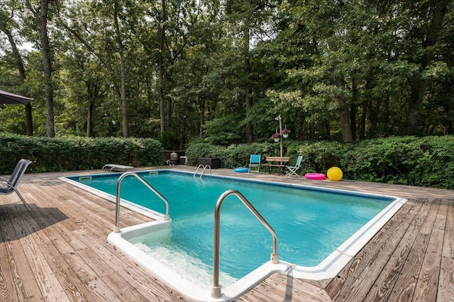 view of pool featuring a wooden deck