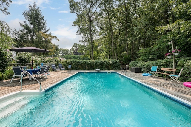 view of pool featuring a wooden deck