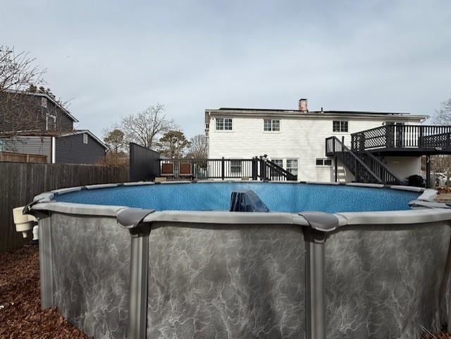 view of pool with a wooden deck