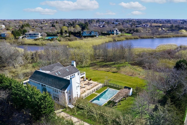 birds eye view of property with a water view