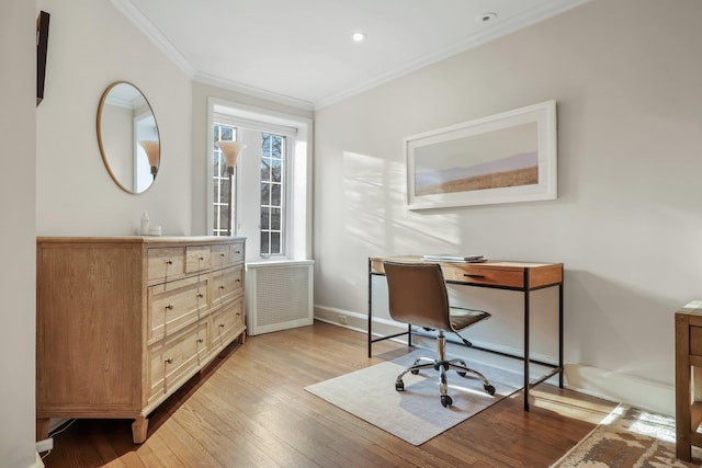 office featuring radiator, ornamental molding, and light hardwood / wood-style floors