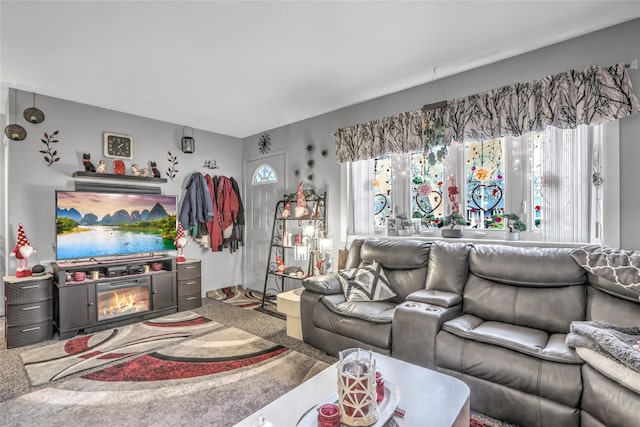 carpeted living room with plenty of natural light