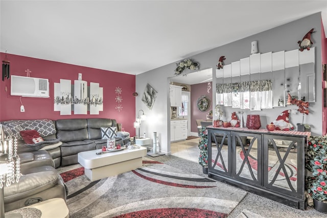 living room featuring an AC wall unit