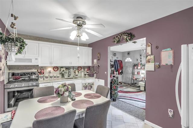 dining space with ceiling fan