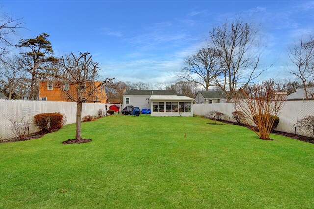 view of yard with a sunroom