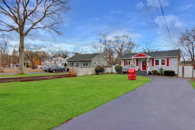 view of front of home with a front lawn