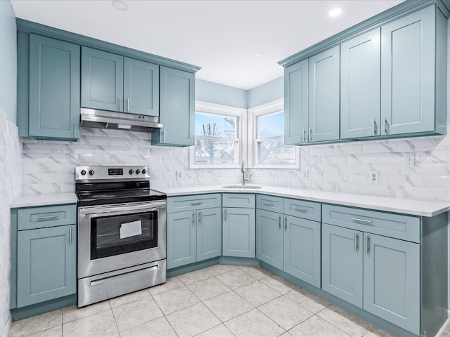 kitchen featuring stainless steel range with electric stovetop, sink, backsplash, and light tile patterned floors