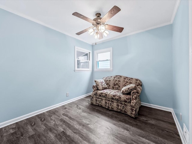 sitting room with ornamental molding, dark hardwood / wood-style floors, and ceiling fan