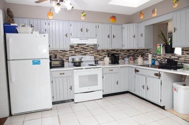 kitchen featuring sink, white appliances, light tile patterned floors, ceiling fan, and decorative backsplash