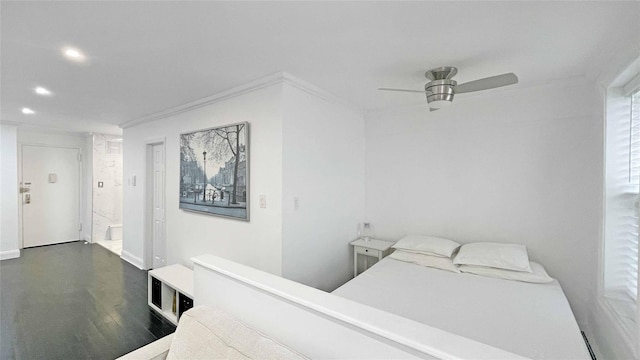 bedroom with dark hardwood / wood-style floors and ceiling fan