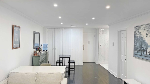 interior space featuring crown molding and dark hardwood / wood-style floors