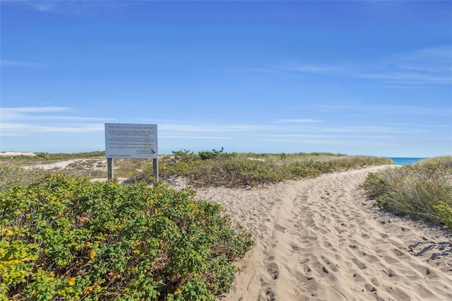 surrounding community featuring a water view