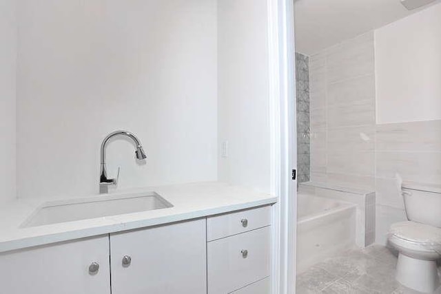 full bathroom with vanity and toilet