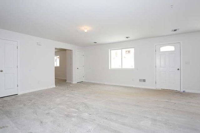 interior space featuring baseboards