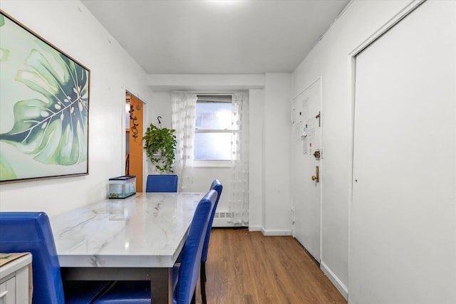 dining room with hardwood / wood-style flooring