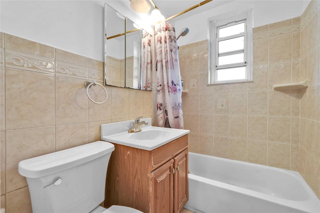 full bathroom featuring shower / bathtub combination with curtain, vanity, toilet, and tile walls