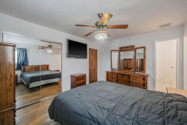 bedroom with wood-type flooring, a closet, and ceiling fan