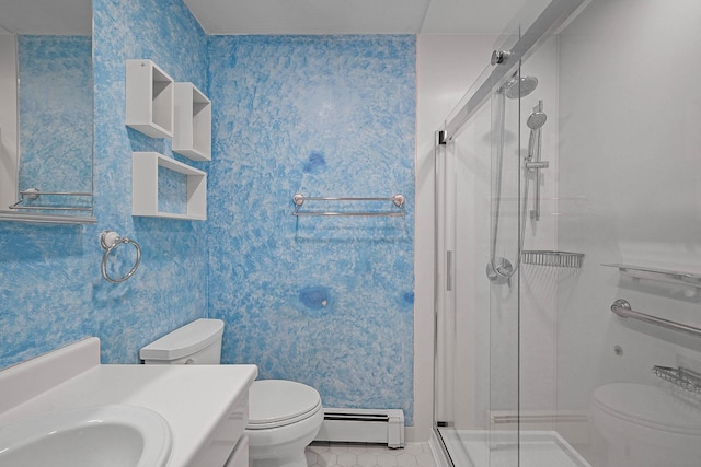 bathroom featuring toilet, baseboard heating, vanity, a shower with door, and tile patterned flooring