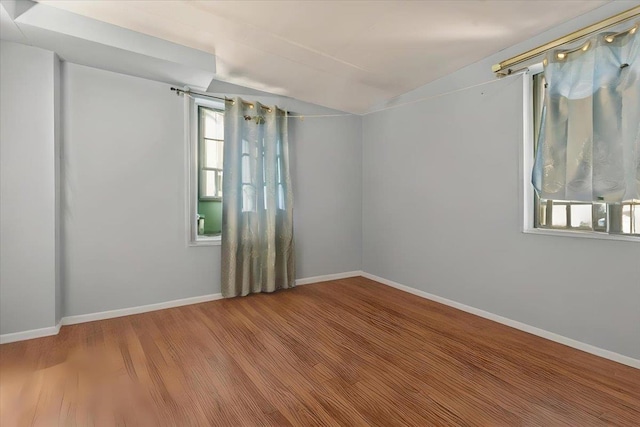 empty room with hardwood / wood-style floors