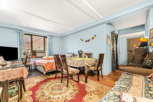 dining space with light parquet flooring