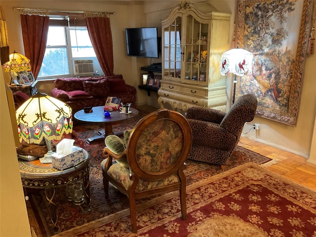 sitting room featuring parquet flooring and cooling unit