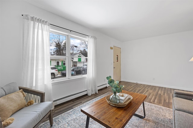 living room featuring hardwood / wood-style flooring and a baseboard radiator