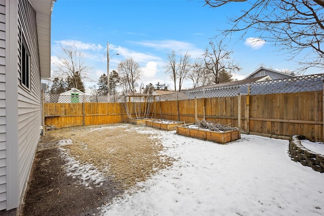 view of yard layered in snow